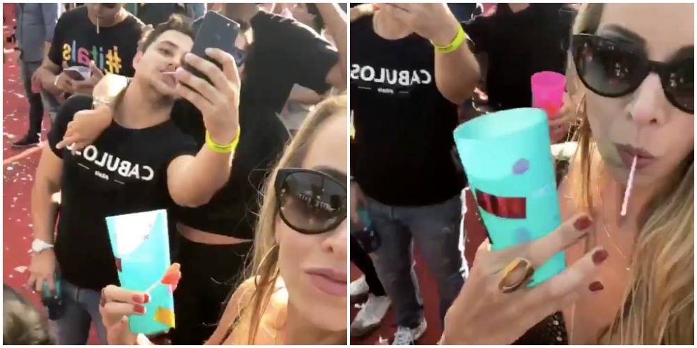 Ung kvinde filmer sig selv på festival – hold nu øje med venstre side af billedet