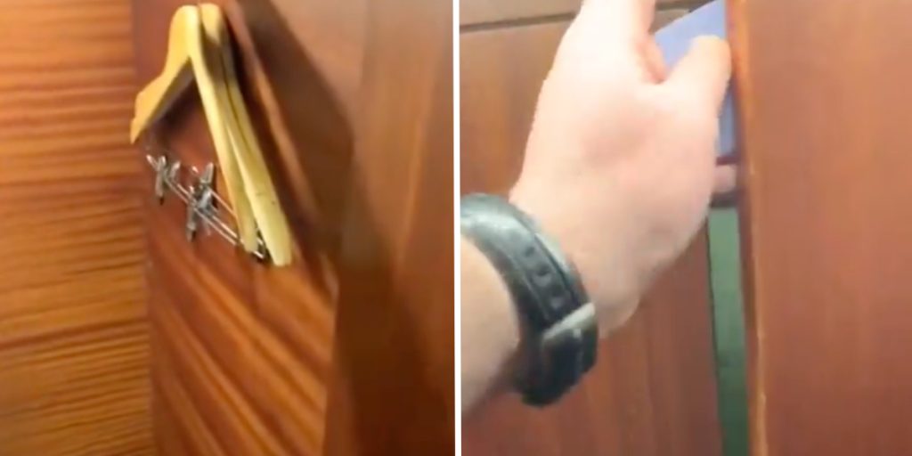 Mand fjerner træplade i skab på hotelværelse: Får et chok over, hvad der gemmer sig bag den